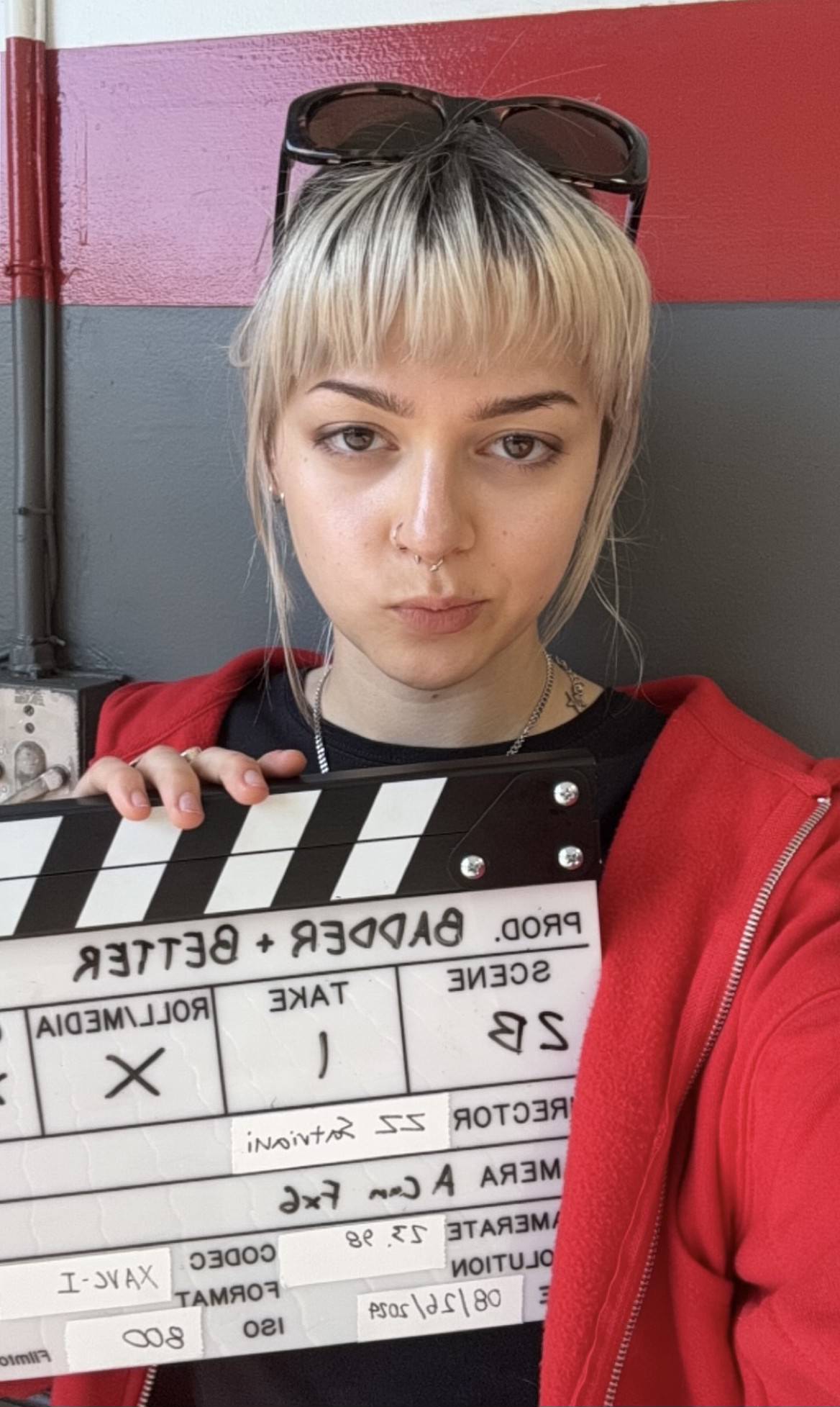Emmy holding a slate at a production
